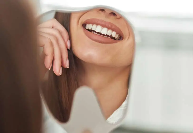 woman smiling after dental care at Laurel Bush Family Dentistry